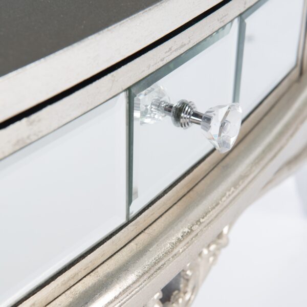 Close up view of the small mirrored drawer with crystal handle on our French Vintage Console Table